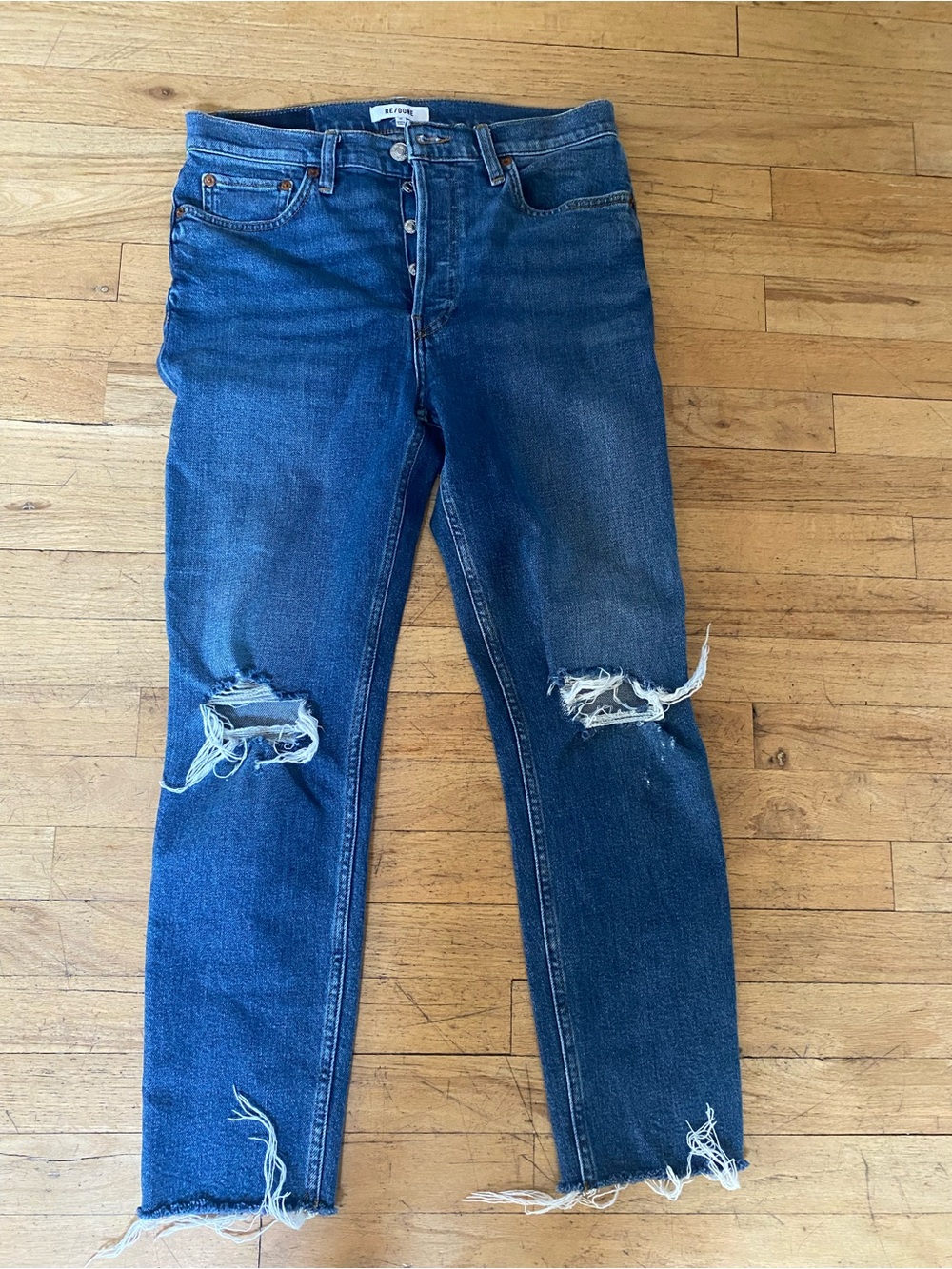 RE/DONE size 28 jeans. 27 inseam. Button closure, raw edge, holes.